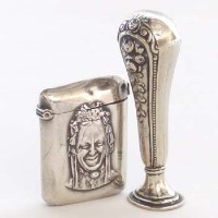 Lot 258 - Novelty vestas case and a seal.