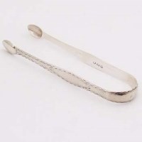 Lot 263 - Pair George III Exeter silver sugar tongs, maker