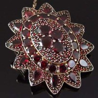 Lot 313 - Victorian oval floret brooch set with garnets.