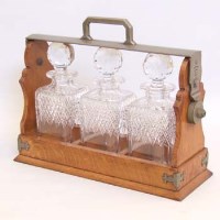 Lot 390 - Three bottle tantalus