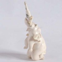 Lot 406 - Ivory model of an elephant and whisky bottle.