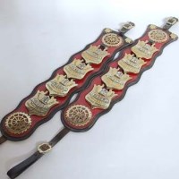 Lot 428 - Pair red leather horse brasses.