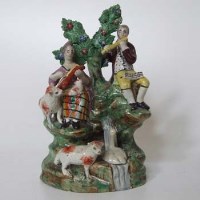 Lot 603 - Staffordshire musicians figure group.