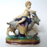Lot 605 - Majolica cherub and goat group