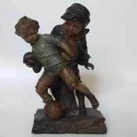 Lot 617 - French terracotta pottery footballing figure group