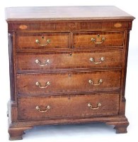 Lot 753 - Oak and cross banded chest of drawers.