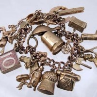 Lot 256 - 9ct gold charm bracelet. 41.2g