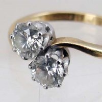 Lot 297 - Gold and diamond cross-over ring
