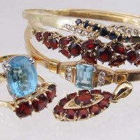 Lot 306 - 18ct gold three-stone garnet ring; 9ct gold