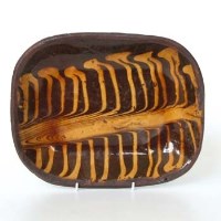 Lot 476 - Early English Slipware baking dish