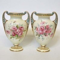 Lot 565 - Pair of Royal Worcester twin handled vases