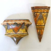Lot 597 - Two Bursley ware Charlotte Rhead design wall pockets