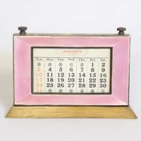 Lot 191 - Silver pink enamel perpetual calendar