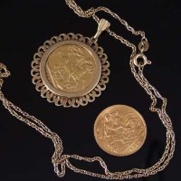 Lot 211 - Mounted gold sovereign and a half sovereign.