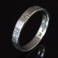 Lot 212 - Platinum band ring, approximately 5.0g.
