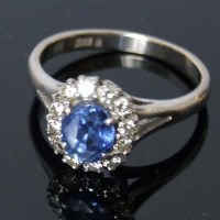 Lot 275 - 14ct white gold sapphire and diamond oval cluster