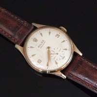 Lot 360 - Rolex precision gents watch nine carat gold.