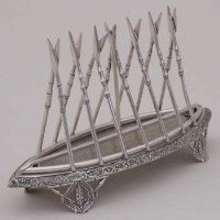 Lot 222 - Silver plated Zulu shield shape toast rack.