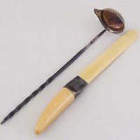 Lot 237 - Whale bone handled punch ladle and an ivoride paper knife.