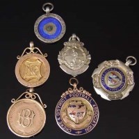 Lot 290 - Three nine carat gold sports medals and three