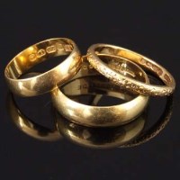 Lot 300 - Three gold rings, twenty-two carat, 14.2g