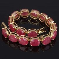 Lot 329 - 18ct gold and ruby bracelet with certificate