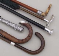 Lot 430 - Two umbrellas plus four walking sticks with
