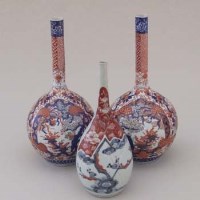 Lot 513 - Pair of Imari bottle vases and another(3)