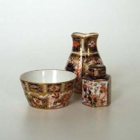 Lot 593 - Royal Crown Derby miniature tea canister and