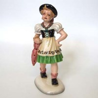 Lot 615 - Keramos figure of a girl.