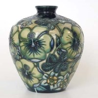 Lot 625 - Moorcroft green floral vase.