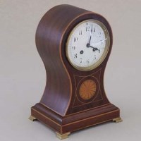 Lot 649 - Edwardian balloon mantel clock.