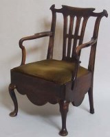 Lot 702 - George III commode chair.
