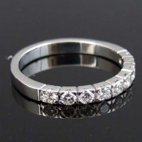 Lot 243 - 18ct white gold half hoop eternity ring.