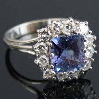 Lot 270 - Tanzanite and diamond square cluster ring, the