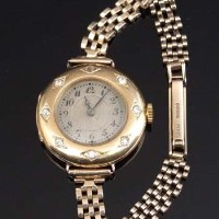 Lot 319 - Longines 18K gold lady's watch with diamond bezel