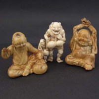 Lot 391 - Japanese ivory figure group of two demons and two