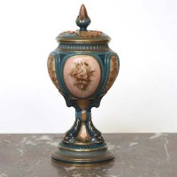 Lot 485 - Hadley’s Worcester lidded vase.