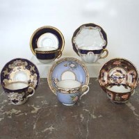 Lot 493 - 5 Royal Crown Derby cups and saucer varios