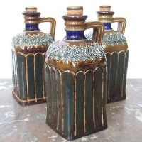 Lot 538 - Set of three Doulton Lambeth flasks DB2841