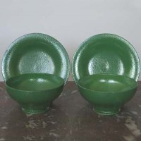 Lot 547 - Two Ruskin Apple Green Bowls and Saucers