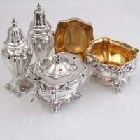 Lot 221 - Five piece silver condiment set