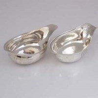 Lot 235 - Two silver engraved pap boats