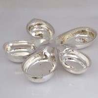 Lot 236 - Five silver pap boats with beaded rims