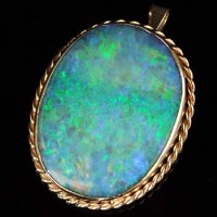 Lot 290 - Oval opal in nine carat gold mount.