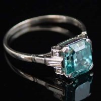 Lot 311 - Platinum and diamond ring with baguette shoulders