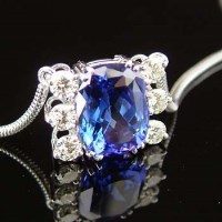 Lot 316 - Tanzanite and diamond pendant, the coloured stone