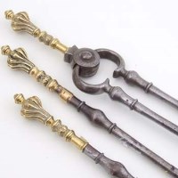 Lot 362 - Three 19th century brass and iron fire irons