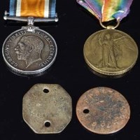 Lot 378 - Two WW1 medals and identity tags (4).