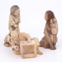 Lot 502 - Three oriental miniature figures.
